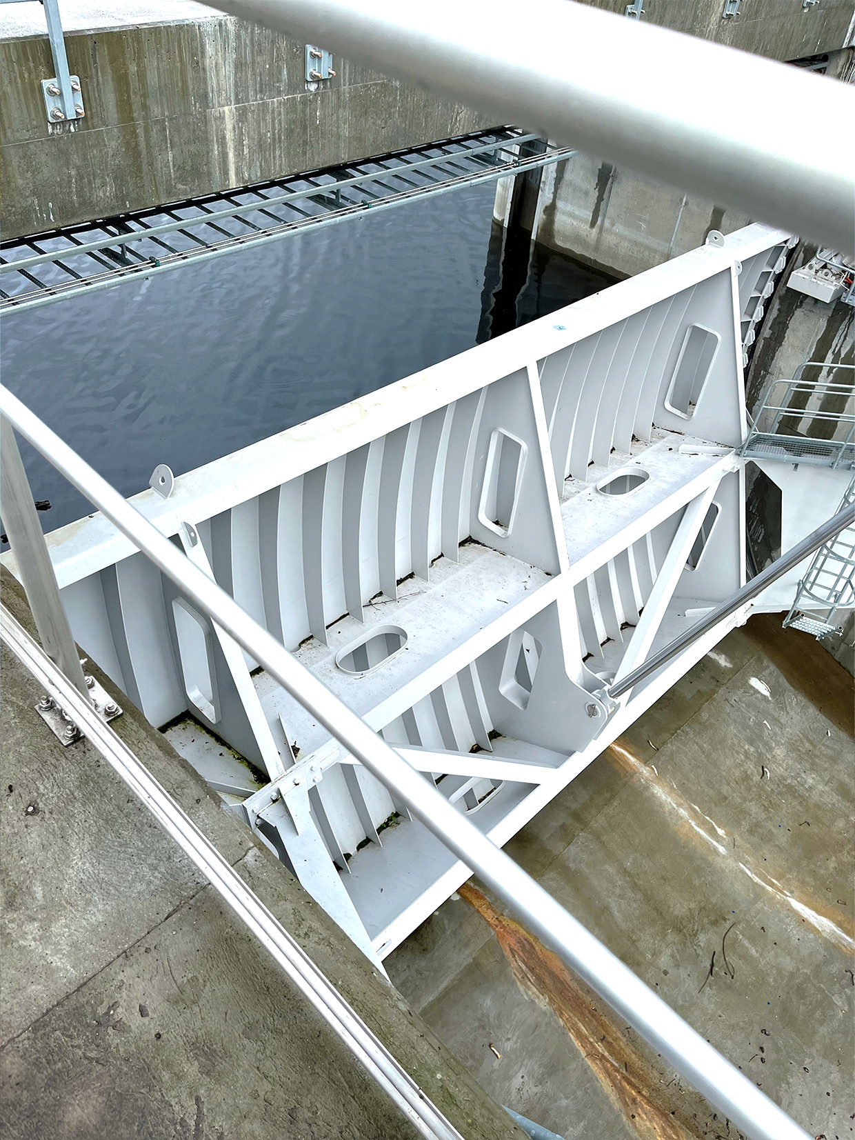 The downstream side of a flood gate with the painted carbon steel structure welded to the dulex stainless steel.
