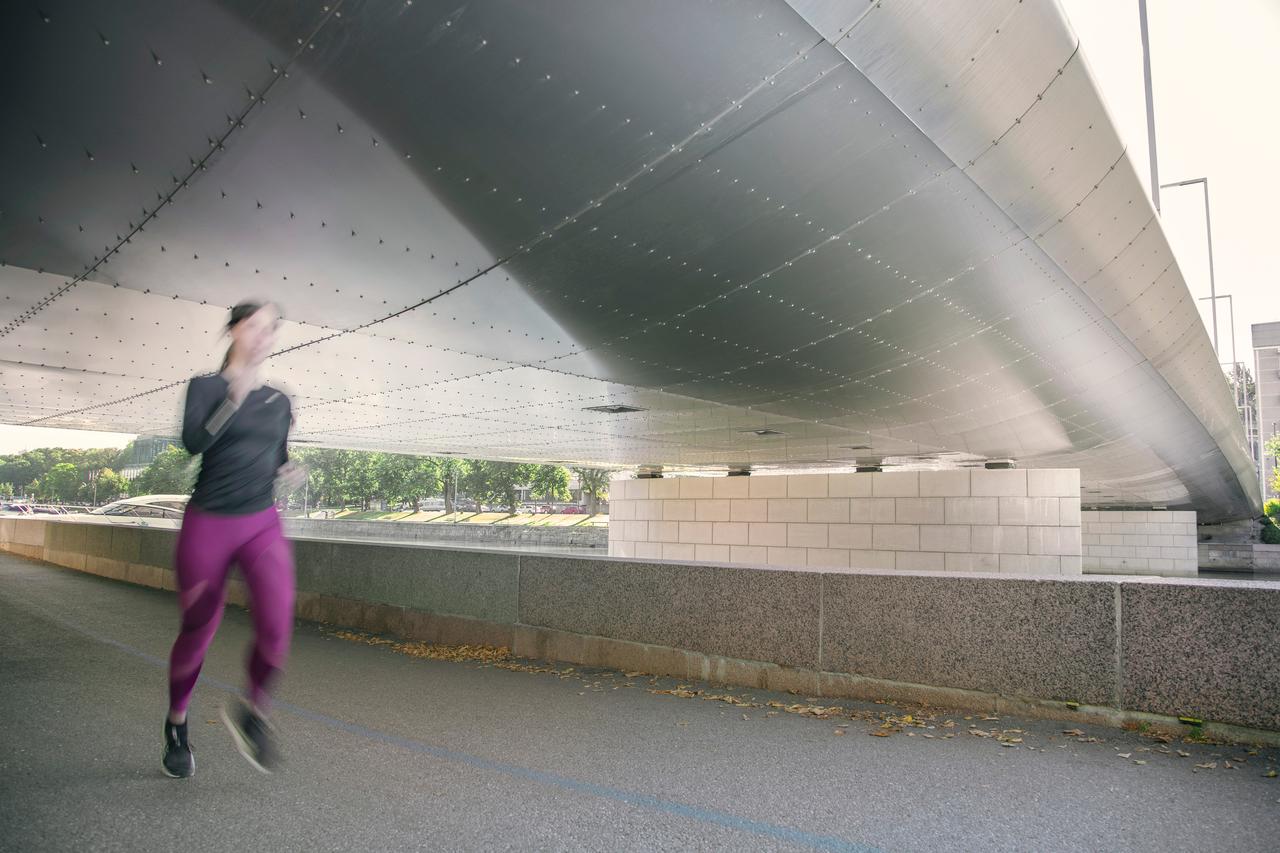Myllysilta bridge press plate with a women running under
