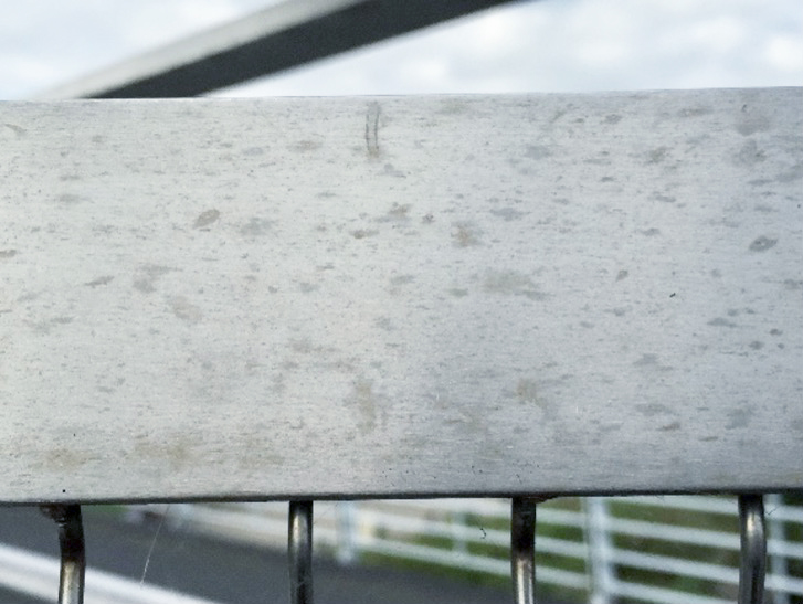 Closeup of corrosion on handrail as example of atmospheric corrosion